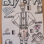 Na rysunku widać mężczyznę ubranego w bawarski strój ludowy oraz symbole niemieckie takie jak: precel, flaga Bawarii i Niemiec, kiełbaska.